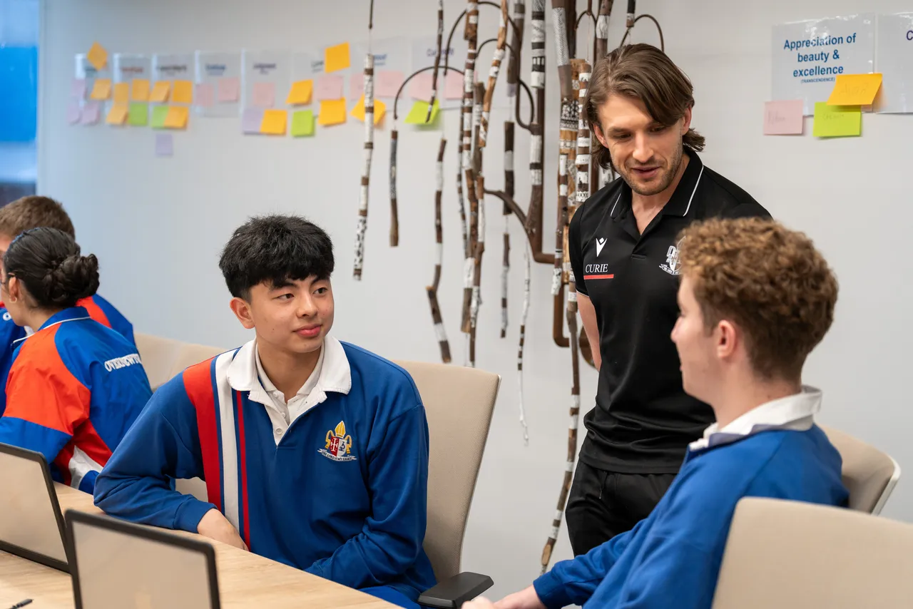 Year 12 Student Executive members in discussion with Overnewton Synergy Leader Josh Reeves during a Student Leadership Workshop.