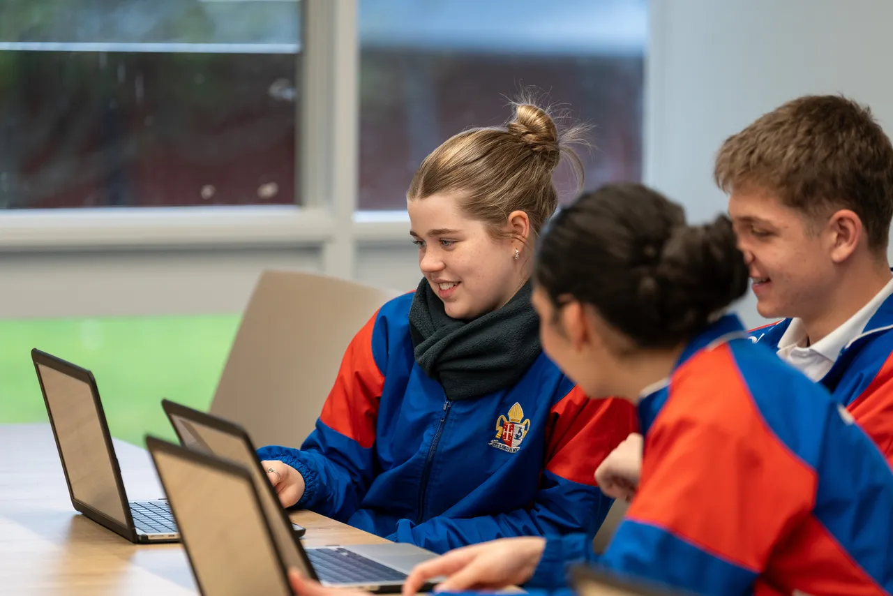 Year 12 Student Executive members working collaboratively using their laptops during a Student Leadership Workshop.