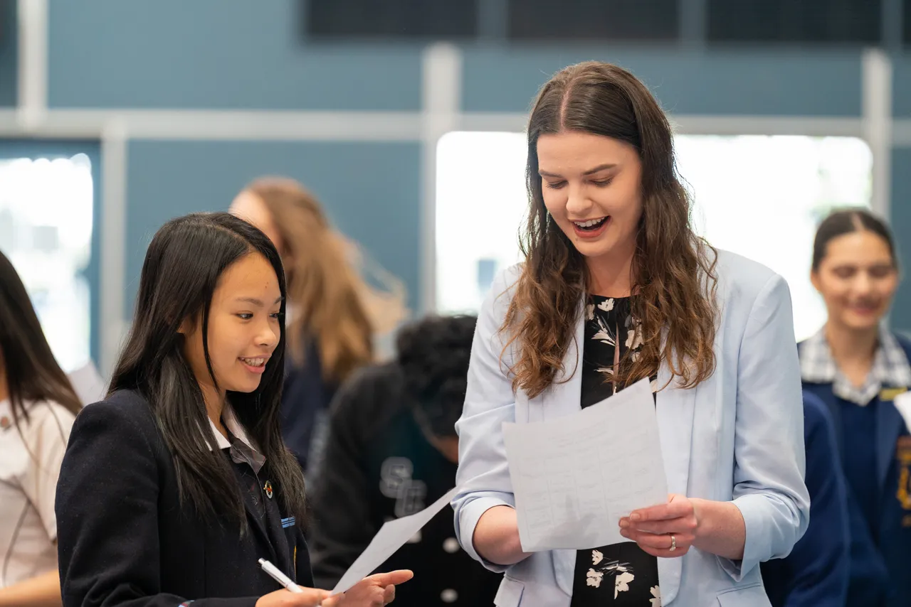 Upper secondary school aged student interacting with Federal MP Alice Jordan-Baird enjoying an icebreaker activity at Overnewton's third annual Student Leadership Summit.