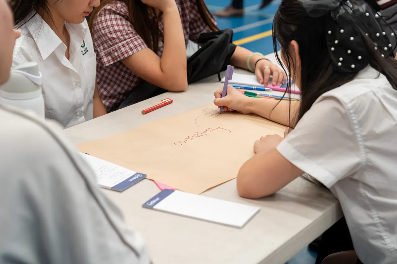 Upper secondary school aged students from various schools in Melbourne's North West working collaboratively on a leadership task at Overnewton's third annual Student Leadership Summit.