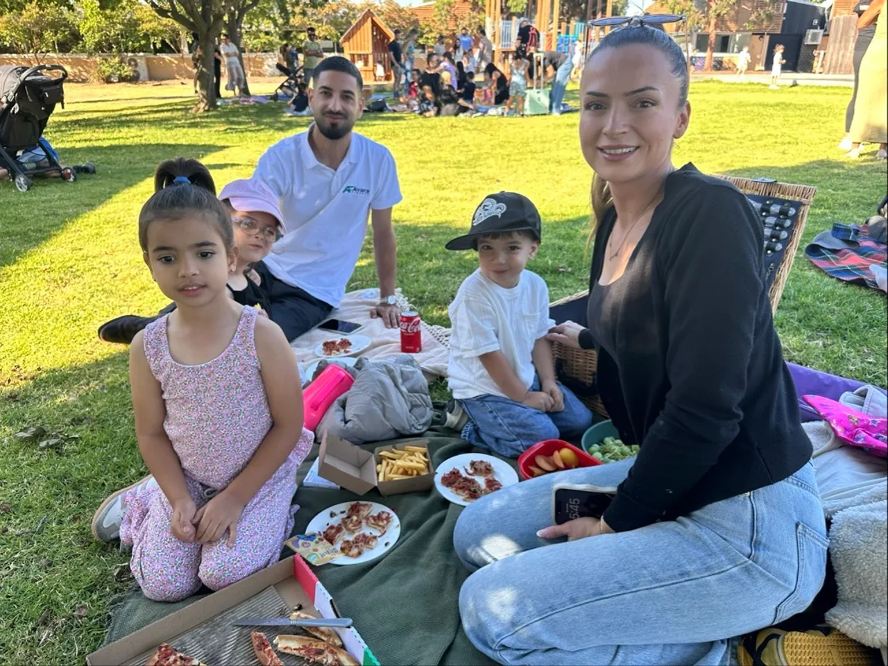 Overnewton family relaxing on a balmy February evening at the 2026 Prep Picnic on the Junior School Prep Lawn at Canowindra Campus in Taylors Lakes.