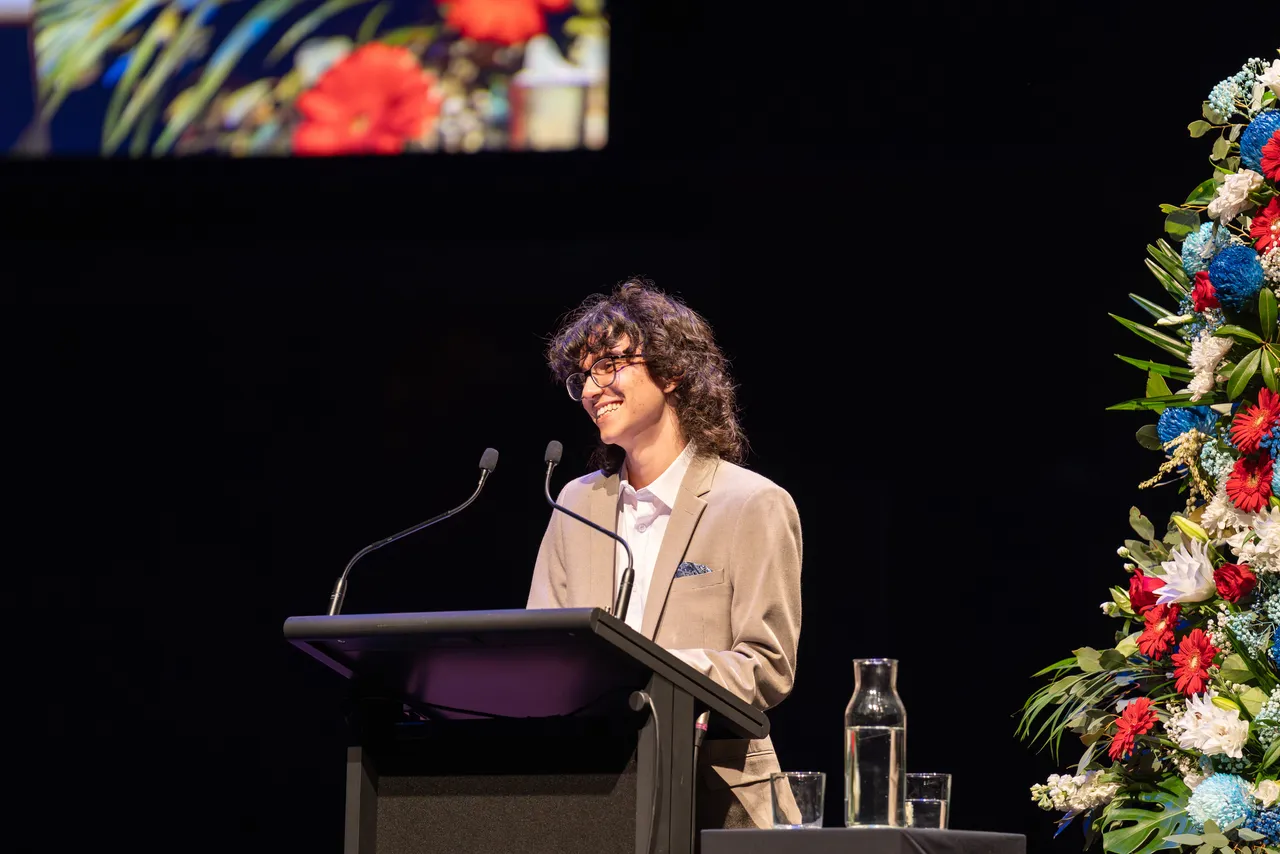 2024 College Dux Dylan Gekas speaking to the audience at Hamer Hall during Overnewton’s 2025 Presentation Night.