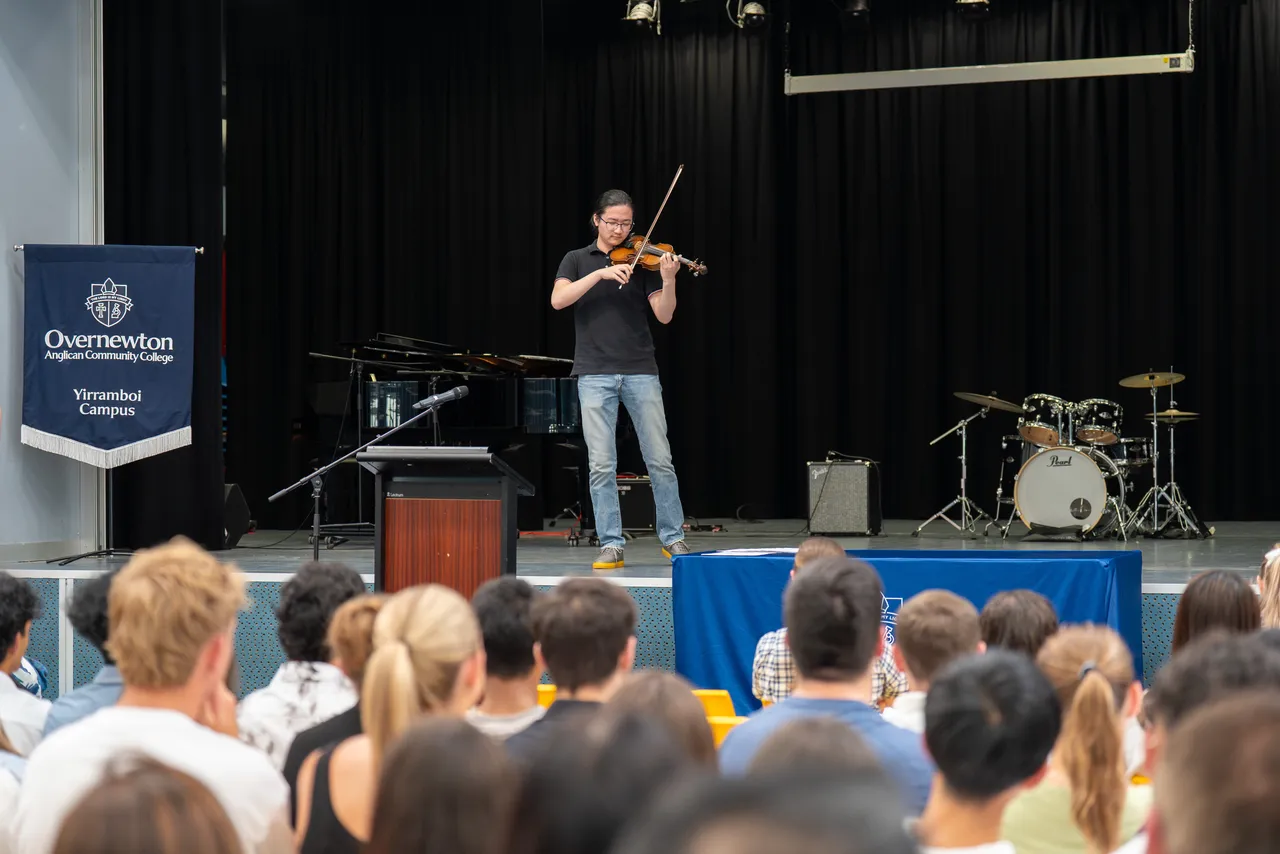 Inaugural recipient of the Overnewton Music Recognition Board, College Dux Nathan Yuan performs on stage at the Class of 2025 VCE Awards Assembly.