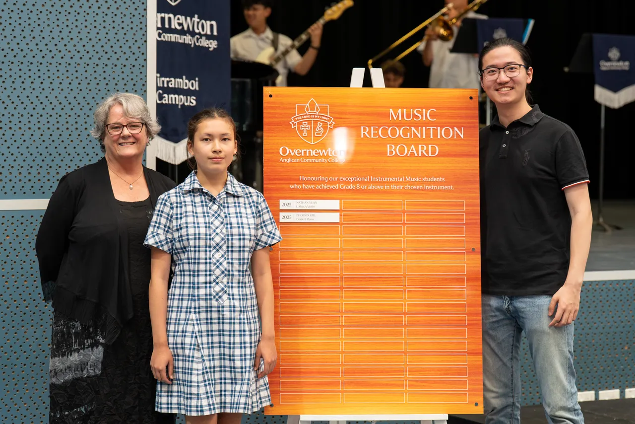 College Head of Performing Arts Carolyn Hernandez with inaugural recipients of the Overnewton Music Recognition Board: Class of 2025 College Dux Nathan Yuan for L.Mus.A Violin and Year 8 student Phoenix Gill for Grade 8 Piano.