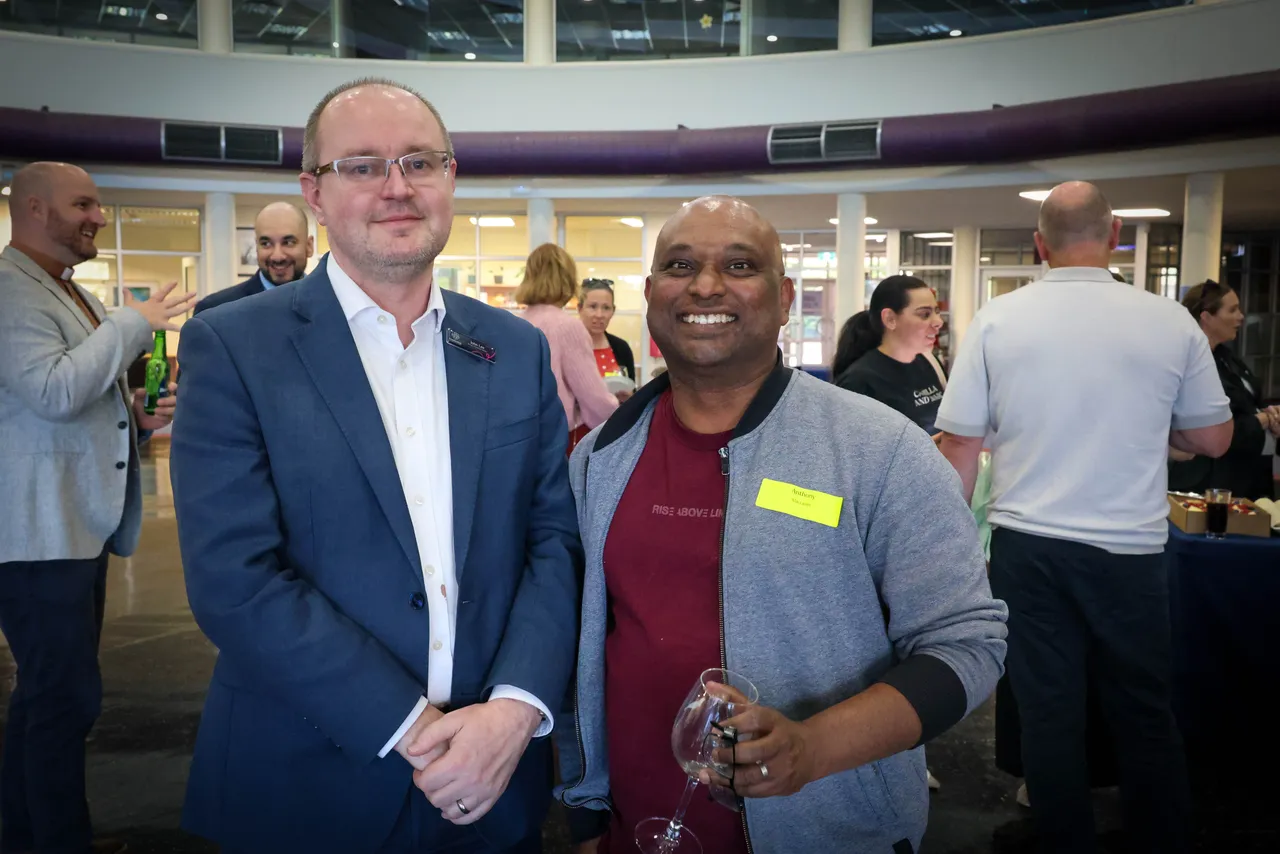 Director of Teaching and Learning, John Lee, and Overnewton Community Engagement Program parent volunteer enjoy a celebratory drink during Overnewton's inaugural Volunteer Appreciation Event, held at the Yirramboi Campus, Keilor.