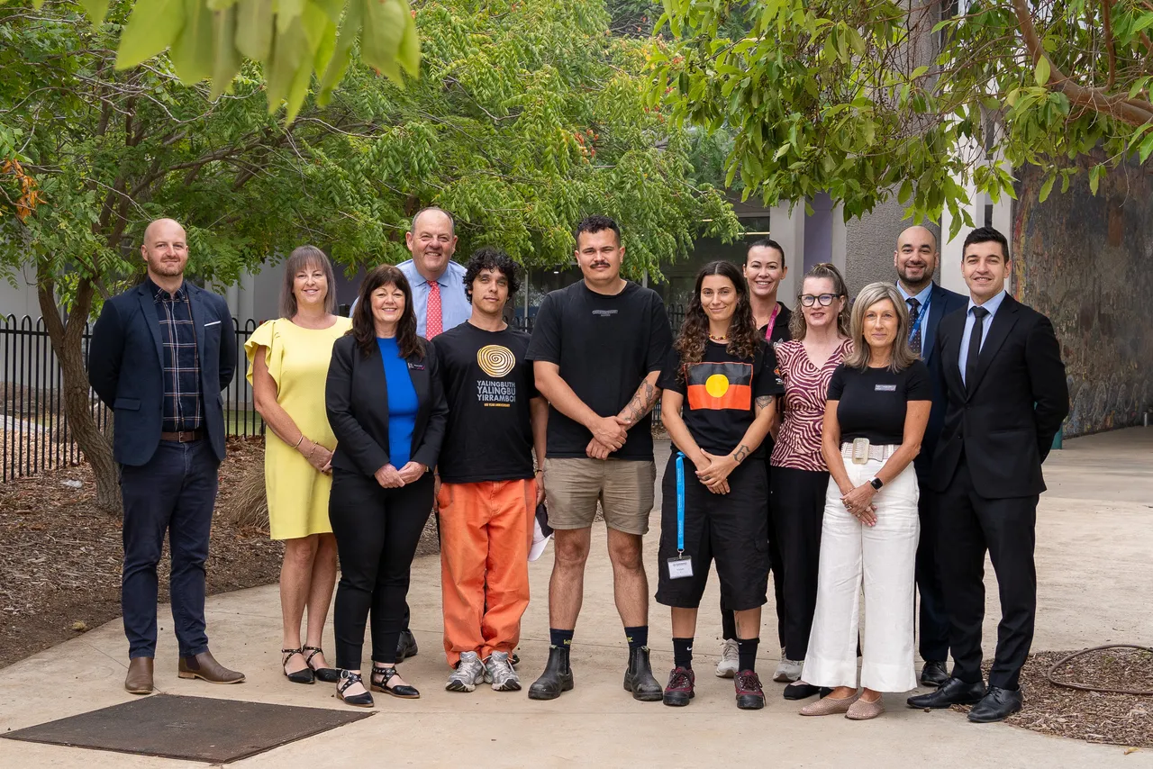 Overnewton College Leadership Team and Middle School Leaders standing with members of the Wurundjeri people of the Kulin Nation during a cultural education session.