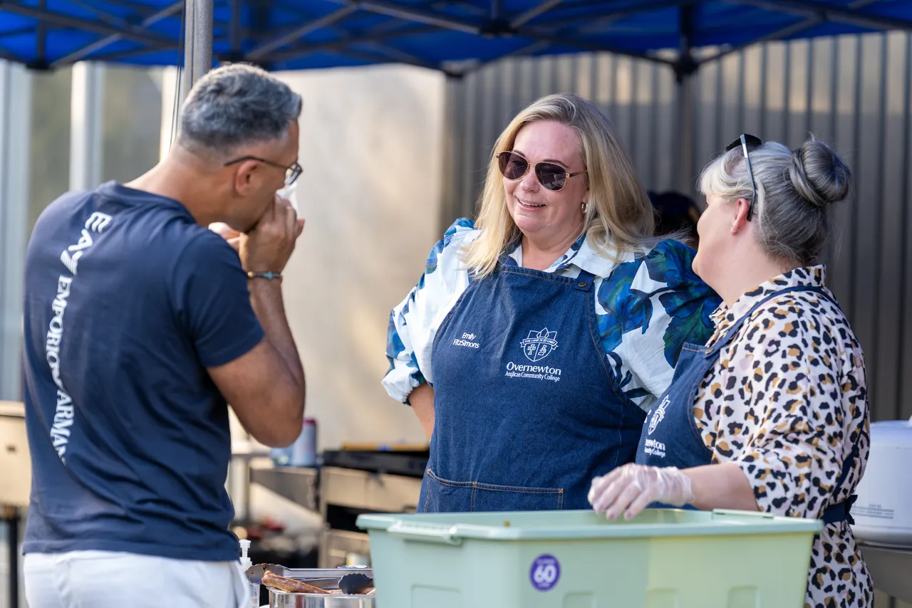 Members of Overnewton College Leadership Team serving a community member at the sausage sizzle during the inaugural Yirramboi Parent Information Evening.