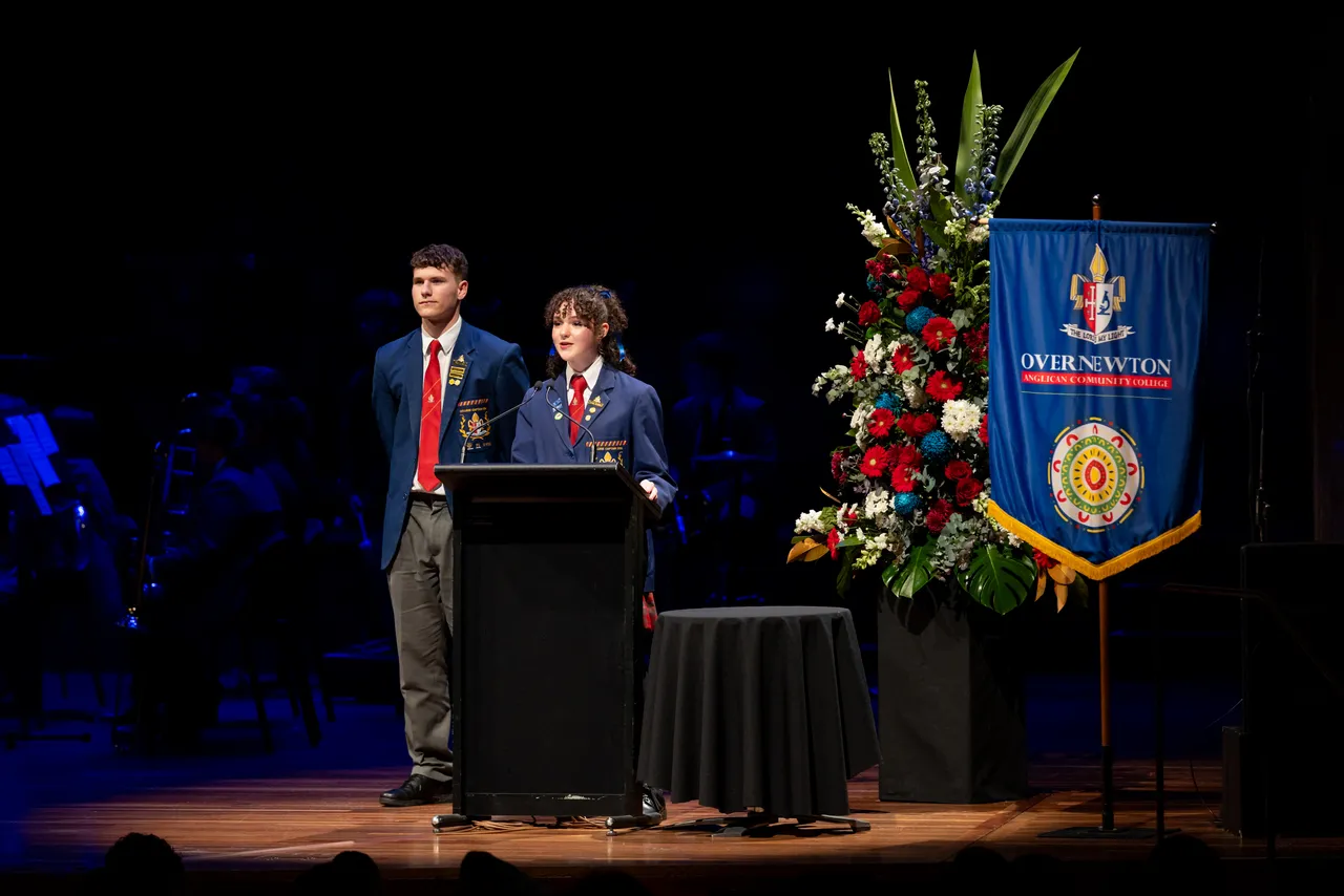 2024 College Captains Finn Armstrong and Lauren Grimaud presenting on stage at Overnewton's 2024 Presentation Night, held at Hamer Hall in Melbourne.