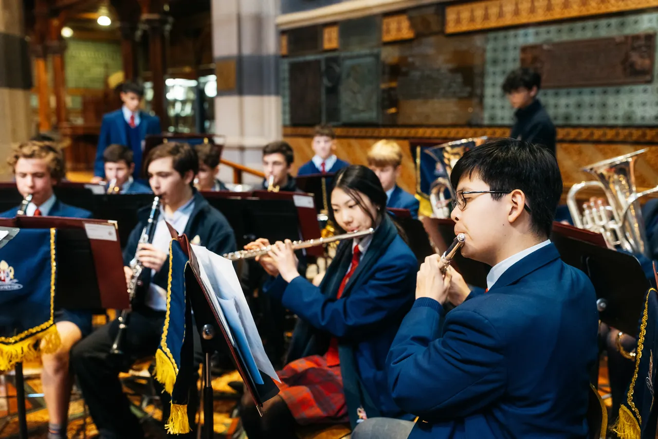 Middle and upper secondary school aged students performing in an orchestra at Overnewton’s Founders’ Day celebration at St Paul’s Cathedral, as part of the Encore Instrumental Music Co Curricular program.