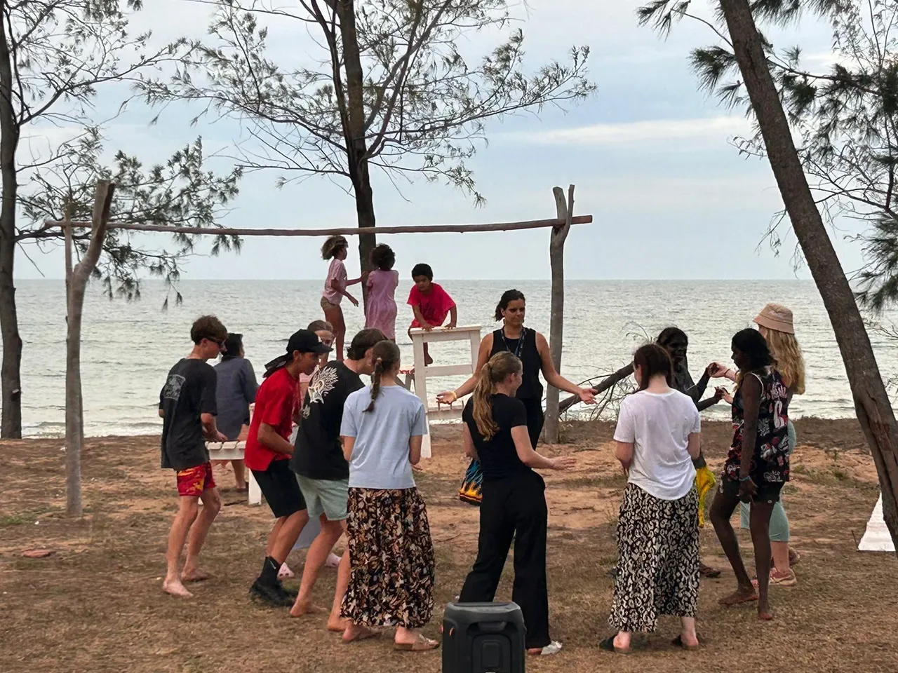 Overnewton students dancing on the beach with students from sister Yapa school, Shepherdson College, during a Learning on Country experience at Galiwin’ku.