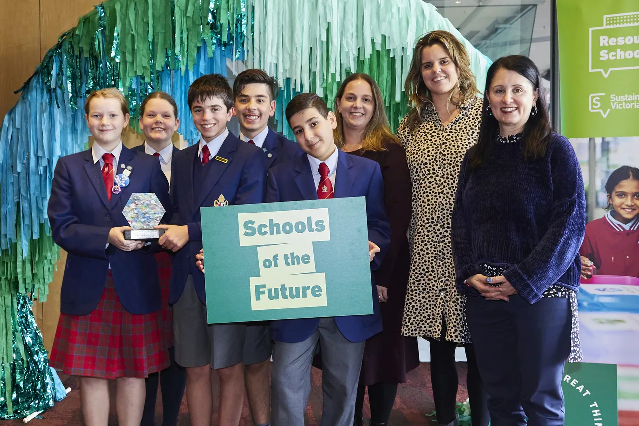 Group photo of lower high school aged students and staff members after winning the School of the Future Sustainability Award.