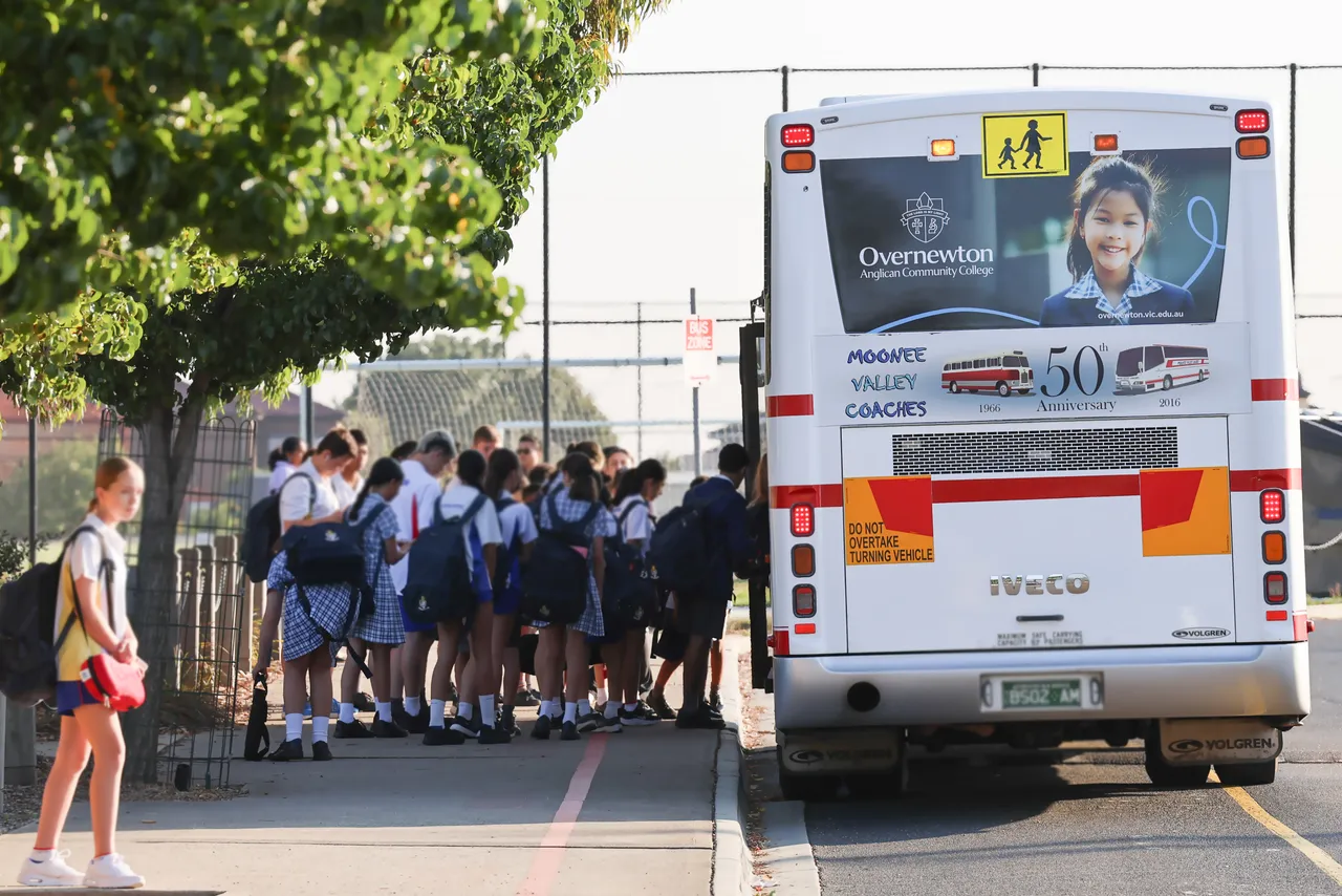 Large group of students boarding the chartered bus in the afternoon at Canowindra Campus