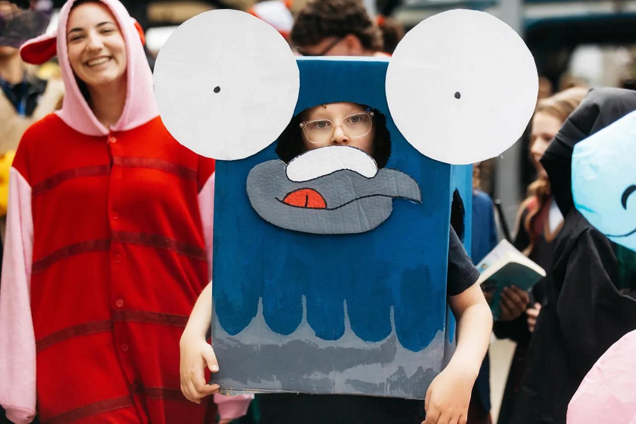 Middle primary school aged student dressed as a beloved storybook character, proudly taking part in Overnewton’s annual Junior School Book Week Parade - a celebration of imagination and the joy of reading.