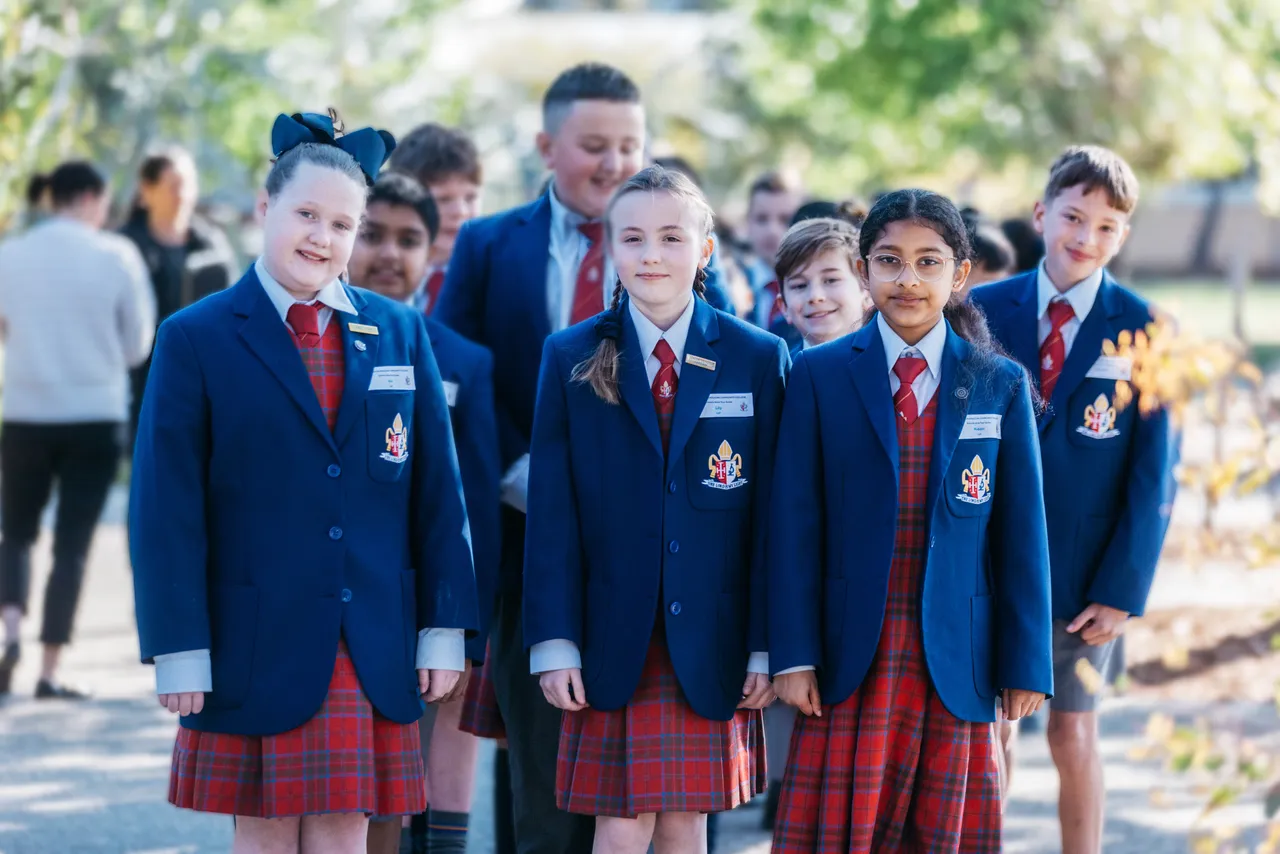 Group of upper primary school aged students waiting to be paired with families for tours during the School Alive event at Canowindra Campus.