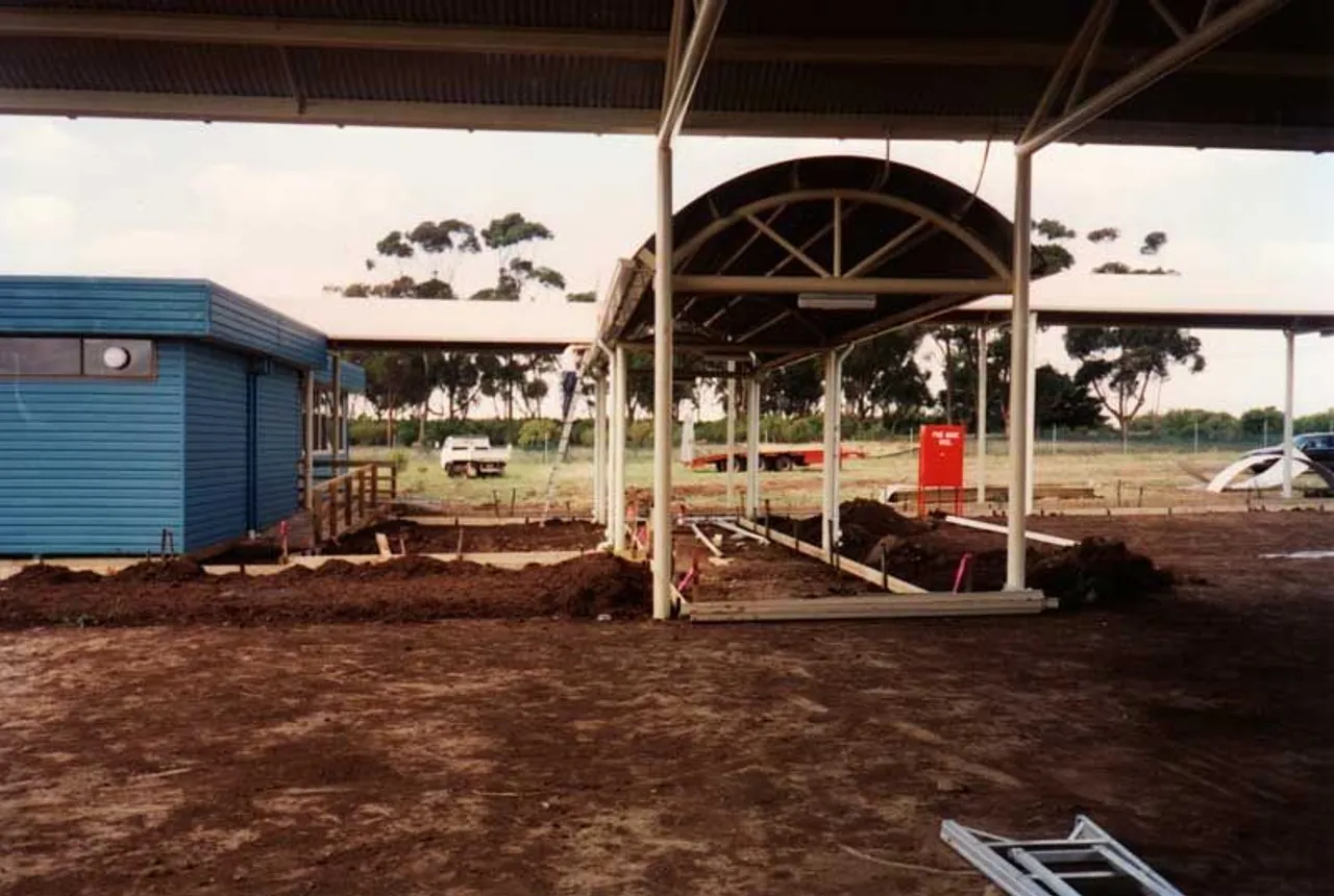 Archival photo from 1995 showing the early stages of construction at Overnewton’s new Taylors Lakes Campus, with two buildings partially constructed and the site actively being developed.
