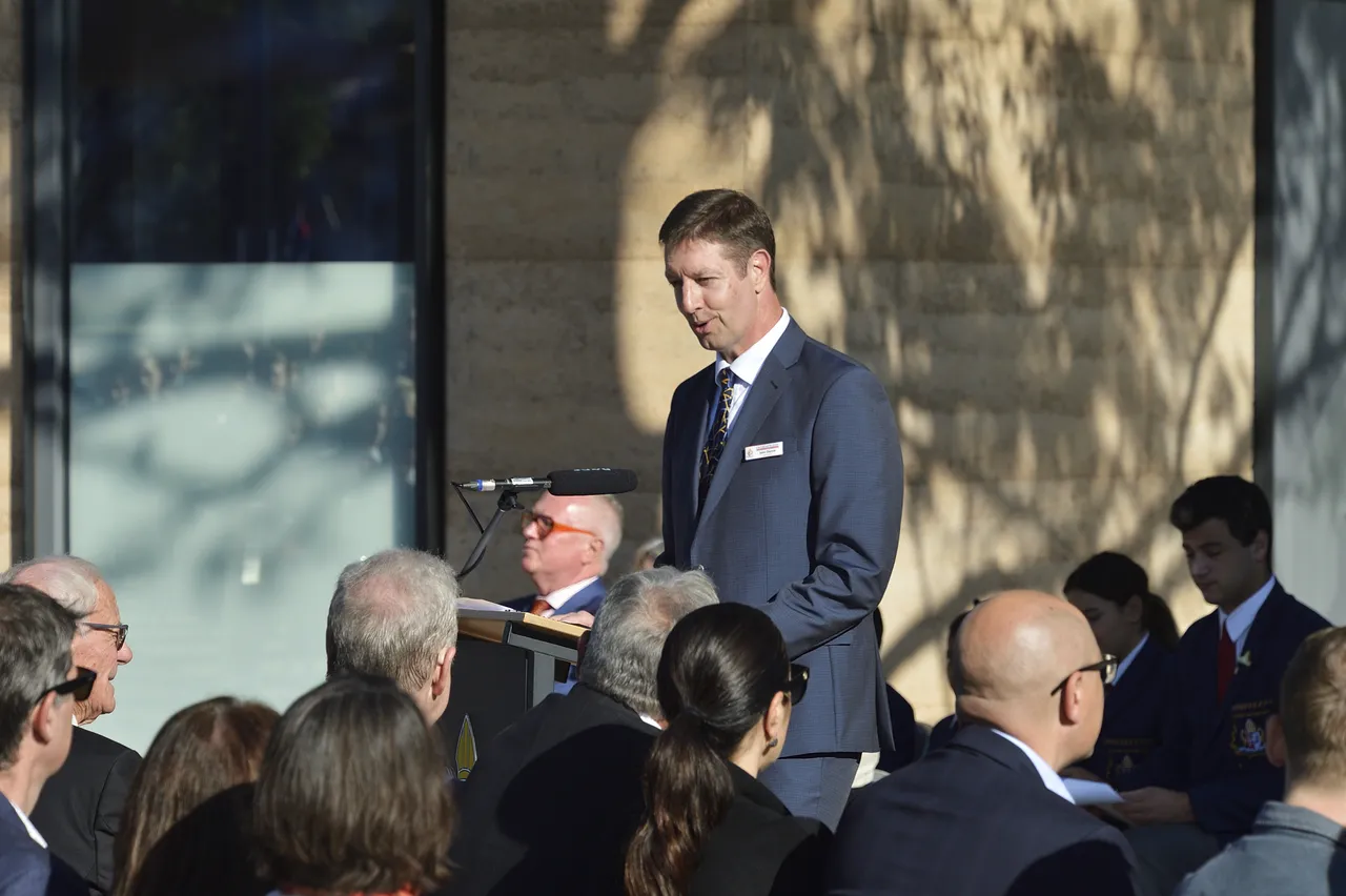 Chair of the Board speaking to the audience during the official opening of the new Prep to Year 2 building at Canowindra Campus, addressing the community and marking the occasion.