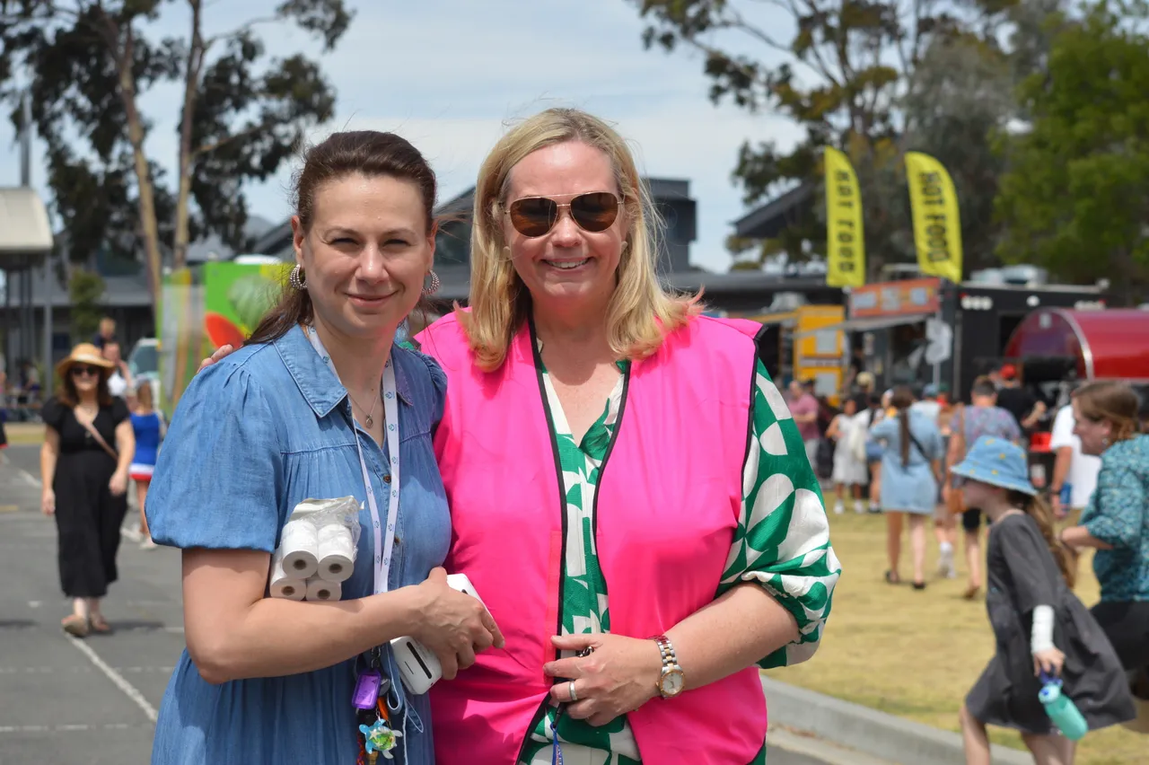 Principal with the Chair of the Fair Committee enjoying the Annual Fair at Overnewton, sharing a moment of community spirit and celebration.