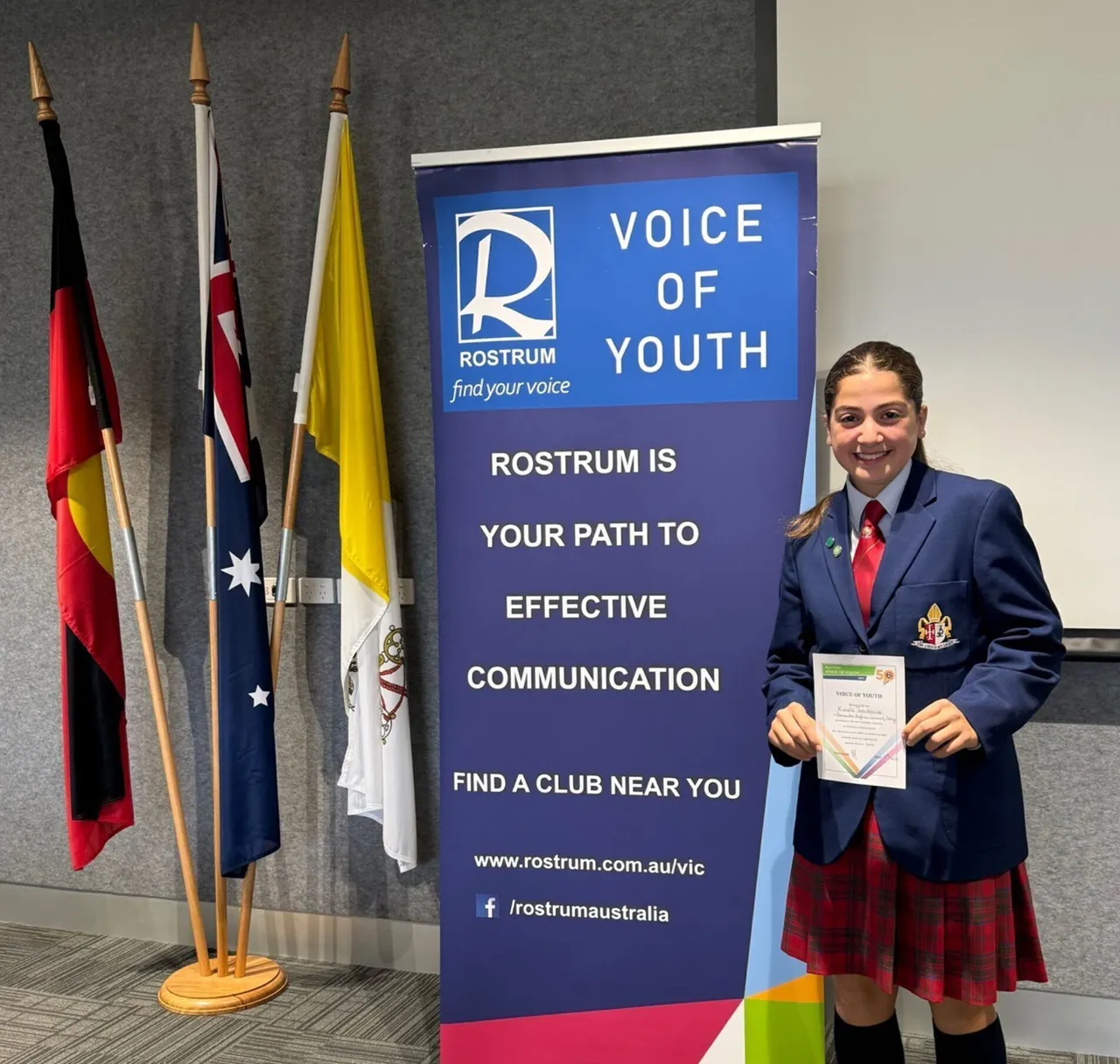 Overnewton student proudly holding her certificate after participating in the Voice of Youth competition, as part of the school’s Be Heard co-curricular public speaking program.