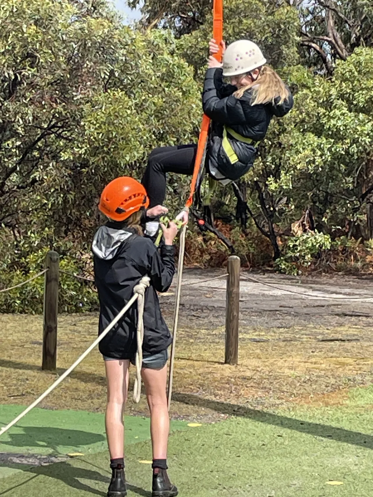 Year 8 Middle School students participating in a ropes course at Phillip Island camp, building teamwork, resilience, and confidence through outdoor adventure activities.