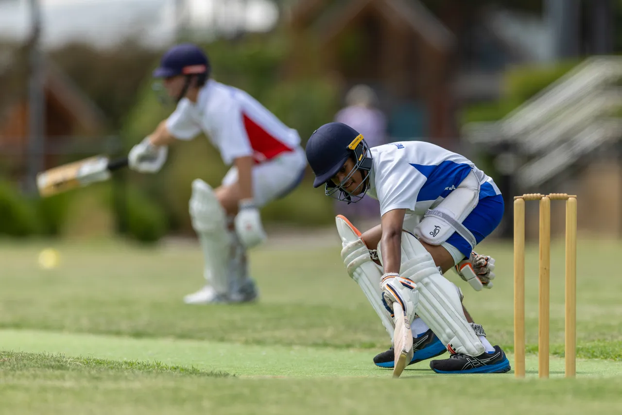 Upper secondary school aged students playing cricket representing Overnewton in the Association of Co-Educational Schools competition, as part of the Activate Co Curriculum program.