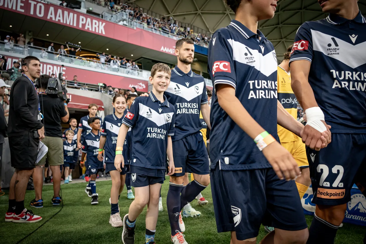 Primary and lower secondary school aged students enjoying an exclusive on-field experience with Melbourne Victory players, as part of Overnewton’s partnership as the first and exclusive football partner school of Melbourne Victory Football Club.