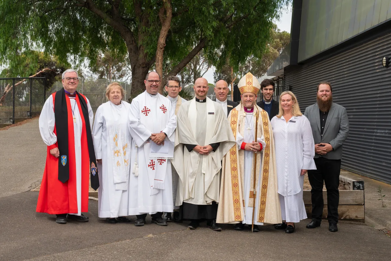 Members of the clergy standing with the Principal in support of Reverend Peter during his Commissioning Service at Overnewton, symbolising unity and shared spiritual leadership.