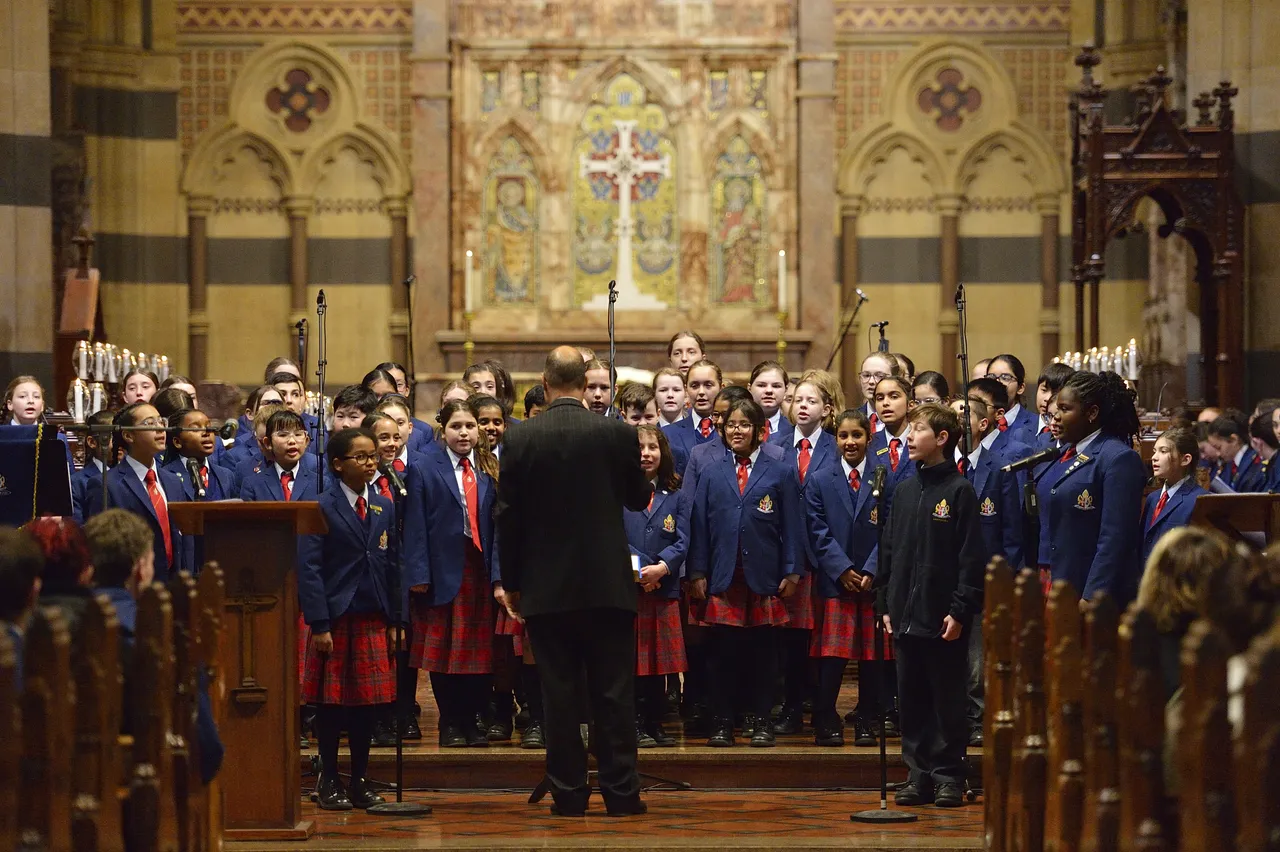 Wide internal shot of St Paul’s Cathedral during the Founders Day Service, featuring the Overnewton choir and musical ensemble performing as part of the service in the grand cathedral setting.