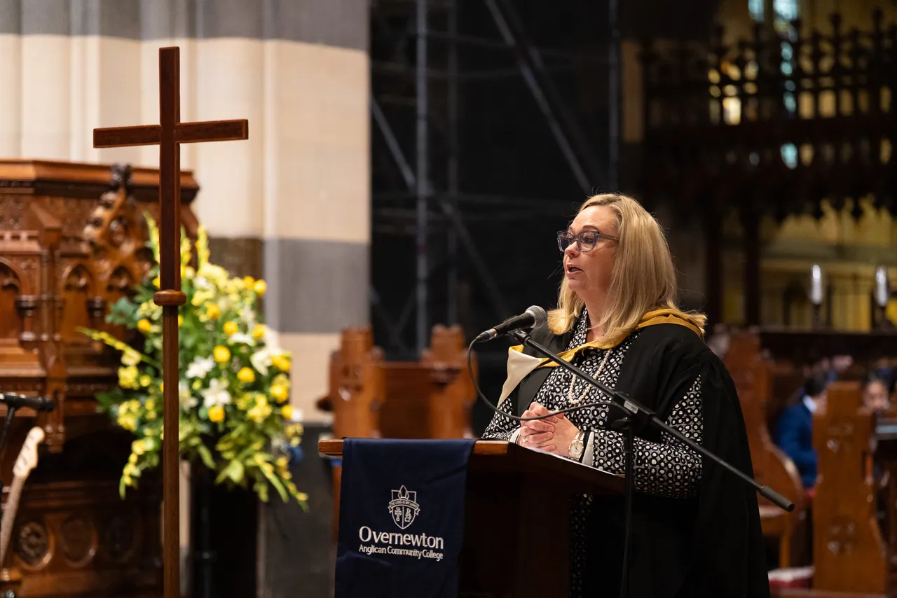 Principal of Overnewton Anglican Community College, an independent school in Melbourne, wearing academic robes, speaking at a lectern during the College’s annual Founders’ Day Service at St Paul’s Cathedral.