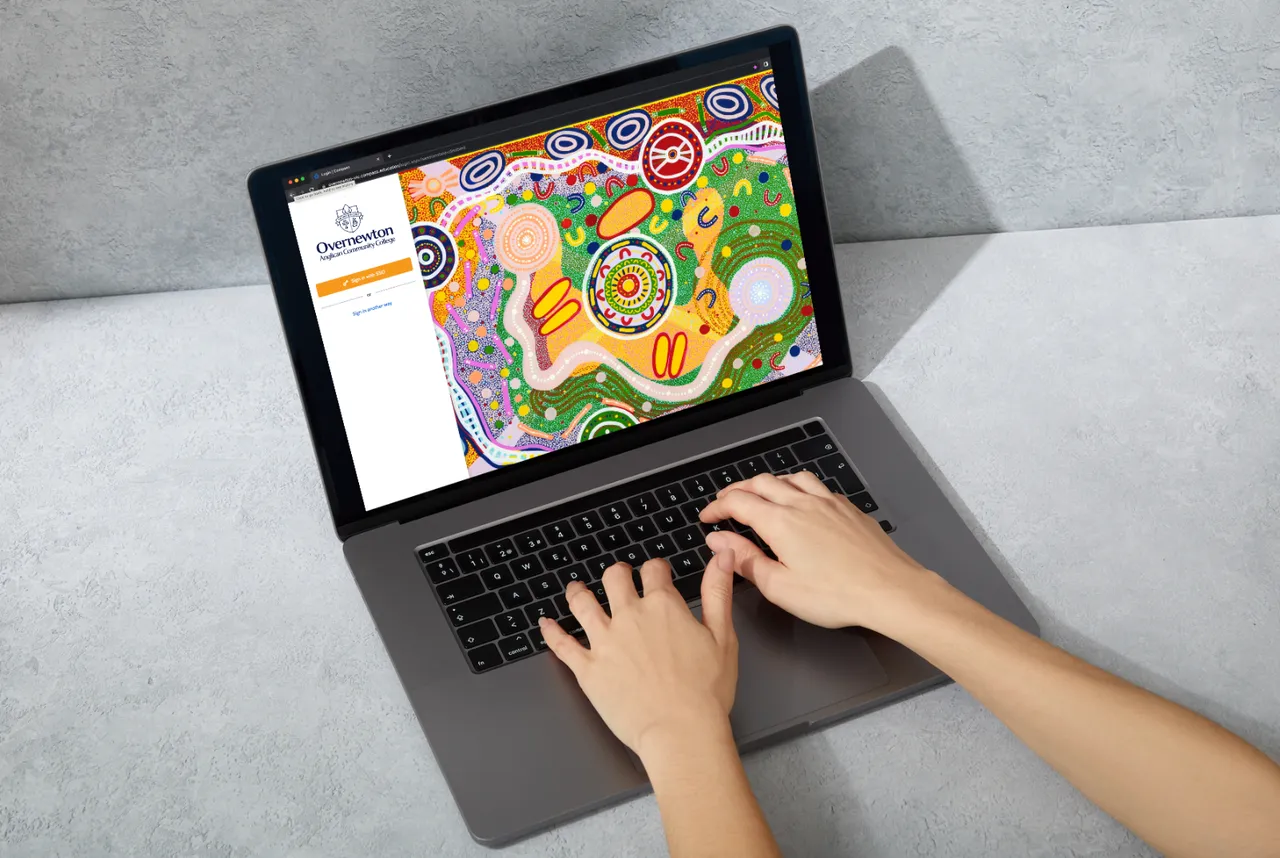 Image of person using a laptop to log into Overnewton's Parent Portal, Compass, our integrated online platform giving families real-time access to important information about their child’s progress and College life.