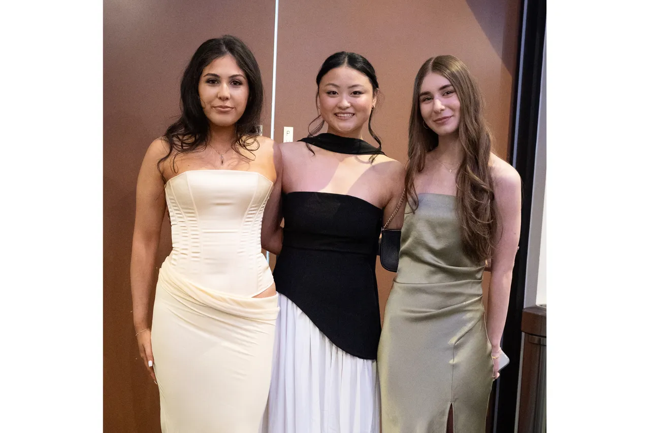 A group of upper secondary students from the Overnewton Class of 2025, smiling directly at the camera in celebration as they gather at their Valedictory Dinner event held at Hyatt Place, Essendon Fields.