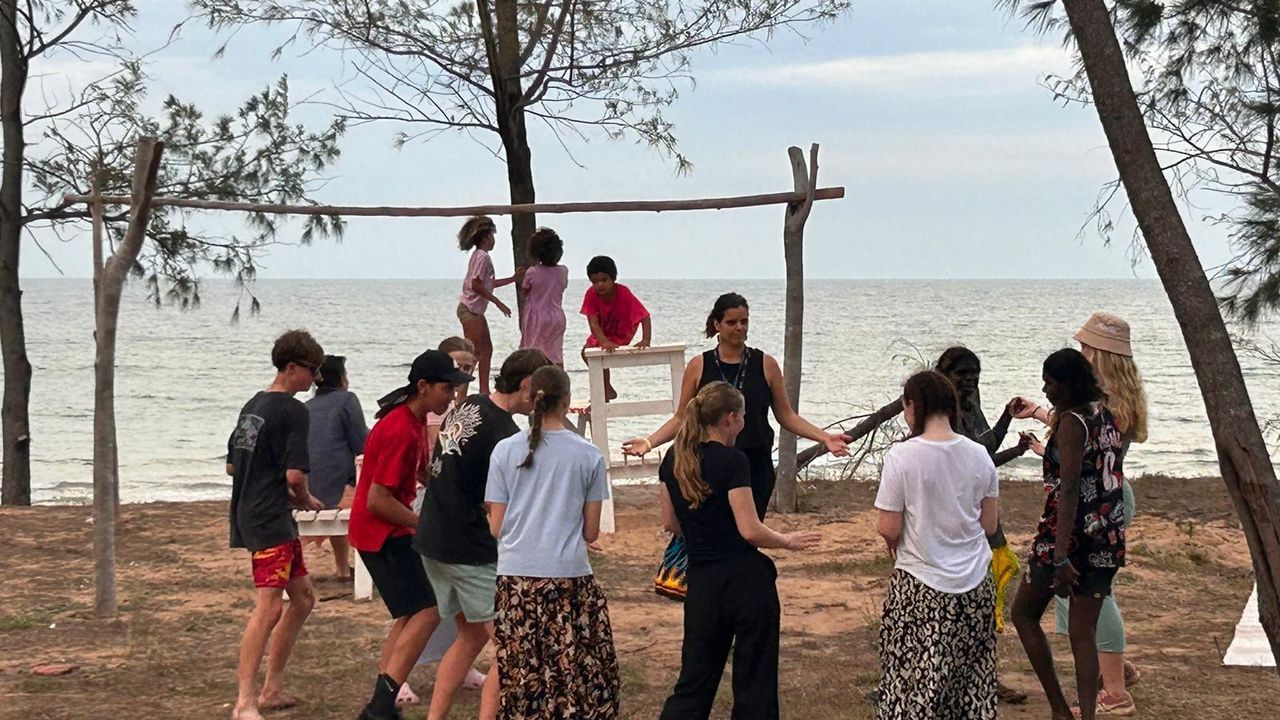 Overnewton students dancing on the beach with students from sister Yapa school, Shepherdson College, during a Learning on Country experience at Galiwin’ku.