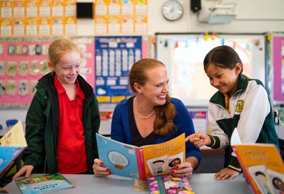 teacher and students reading