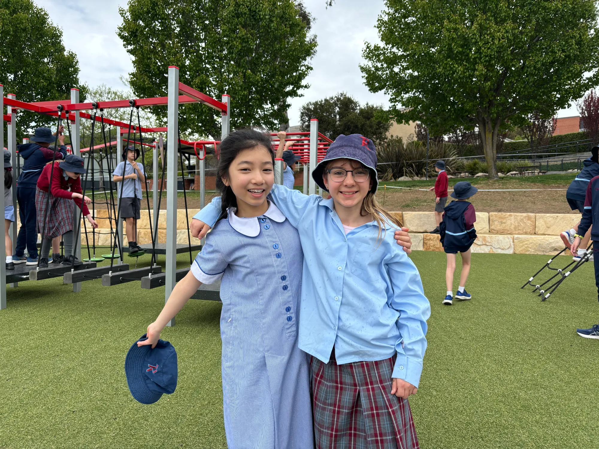 Ivy Jin and Scarlett Ligeros in front of the new Pavilion Playground.