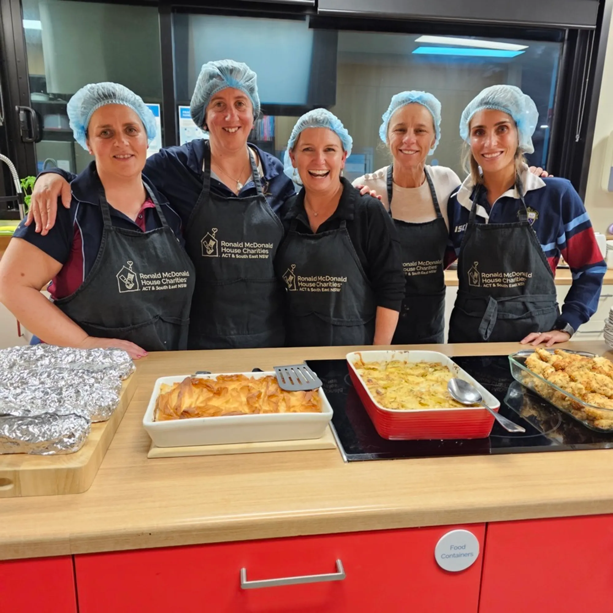 Ms Tracey Markovic (centre) volunteering with Radford College colleagues Mrs Tina Crane, Mrs Jane Lilley and Miss Hayley Oldfield at Ronald McDonald House.