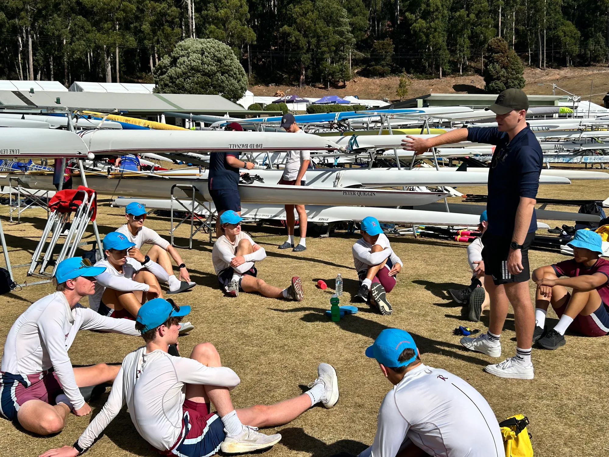 Coach Angus Walker addressing the rowers before their races.