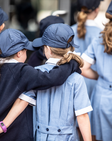 Junior School students walking together, with their arms linked, at Ruyton Girls' School