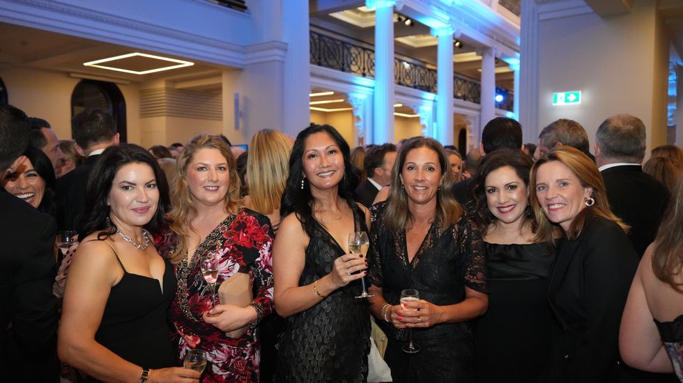 Mothers from Ruyton Girls' School standing and talking together at the Foundation Ball 2023