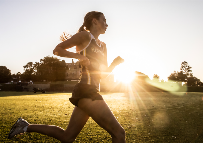 Ruyton student running around the Oval at sunrise.