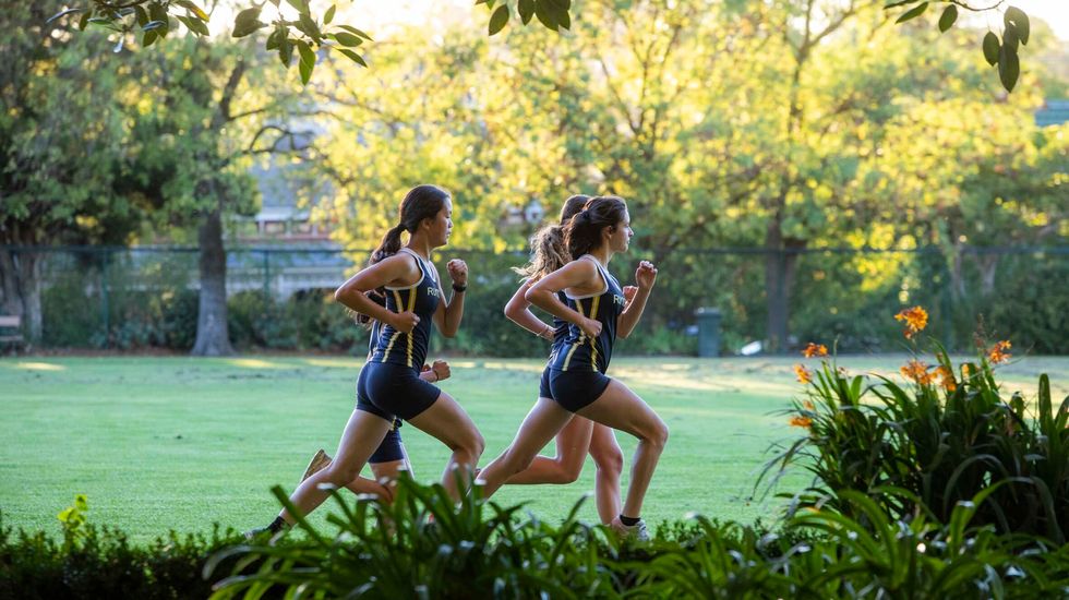 Ruyton students running around the School Oval at Cross Country Practice.