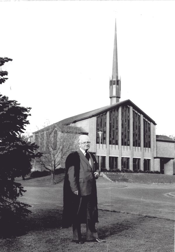 Rev Mac Farlan outside the College Chapel