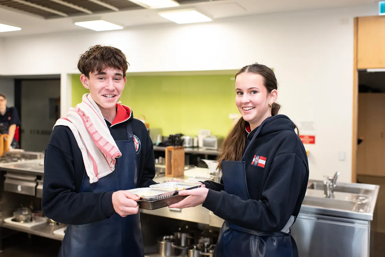 A St Michael's Grammar School two students showcase something they made in food technology class.
