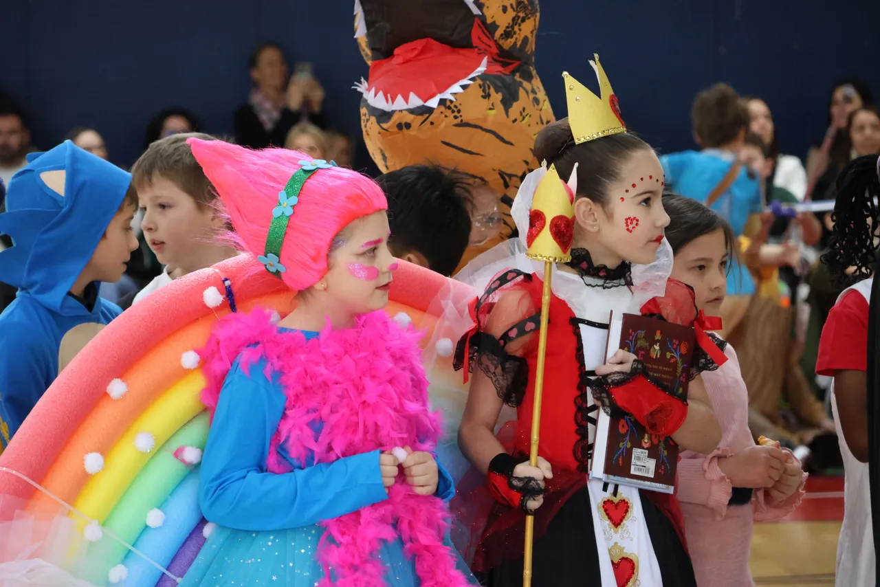 St Michael's Grammar School students in elaborate costumes parade through the gymnasium during the school's Book Week celebration.