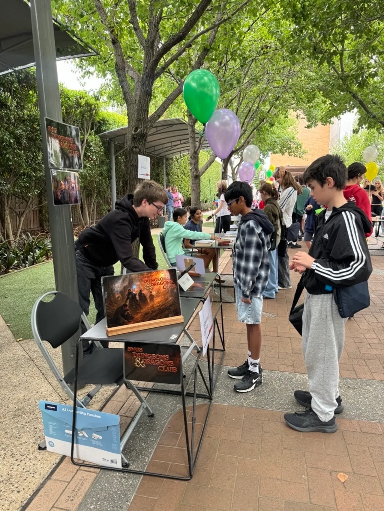 St Michael's Grammar School students engaged in a co-curricular club activity about Dungeons and Dragongs, exploring shared interests on campus.