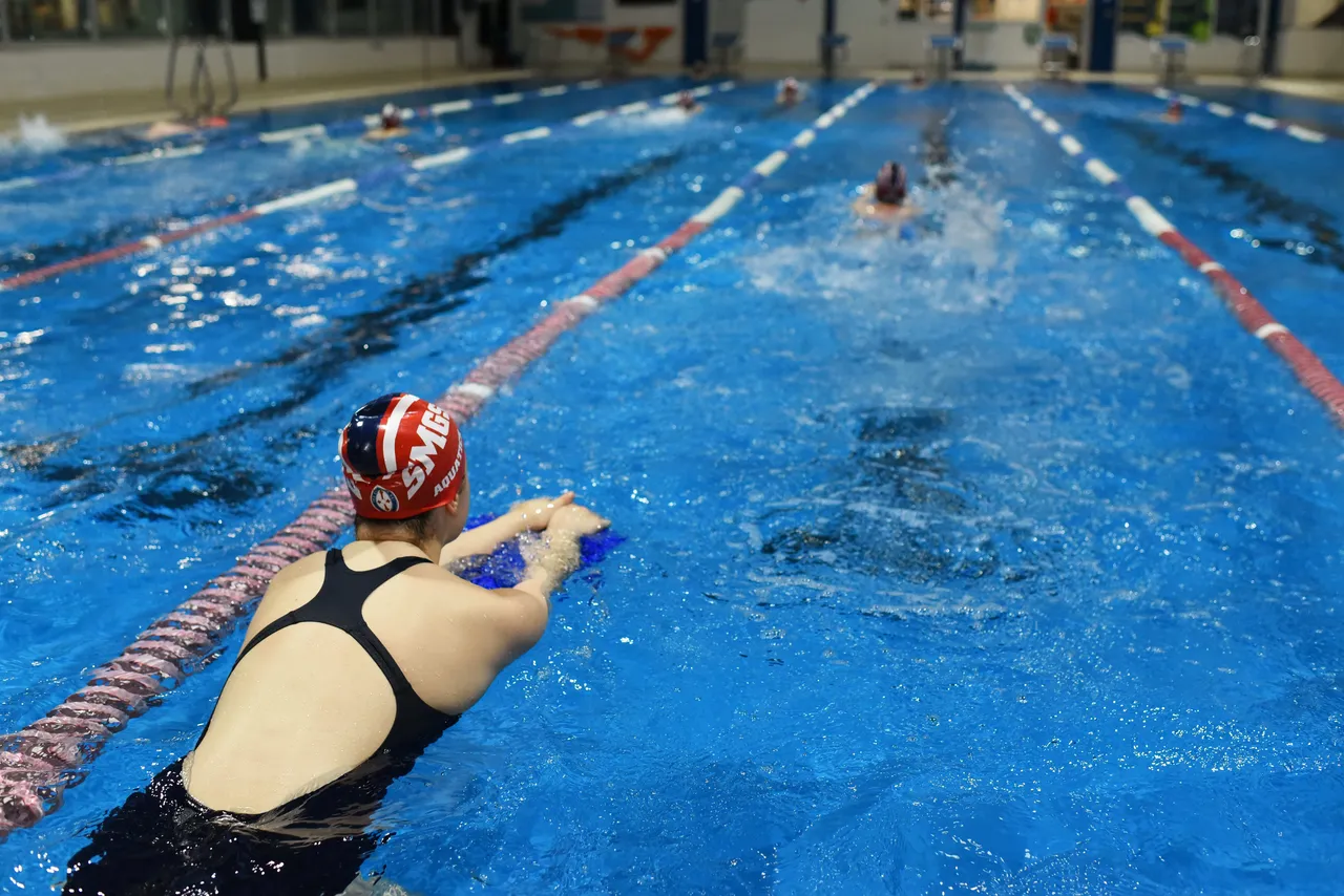 St Michael's Grammar School students swimming competitively during a squad training session at the school's Aquatics Centre.