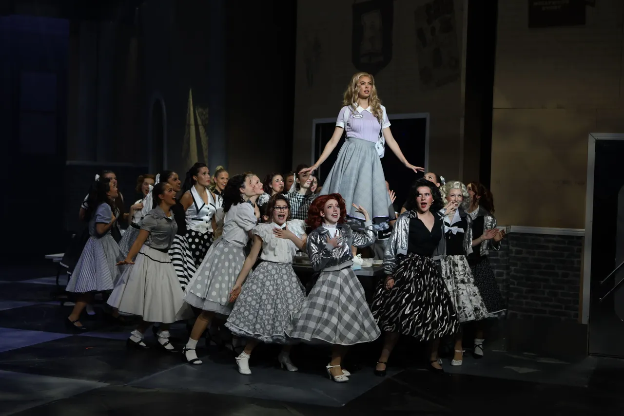 St Michael's Grammar School students perform on stage during a school production at the Performing Arts Centre, St George's.