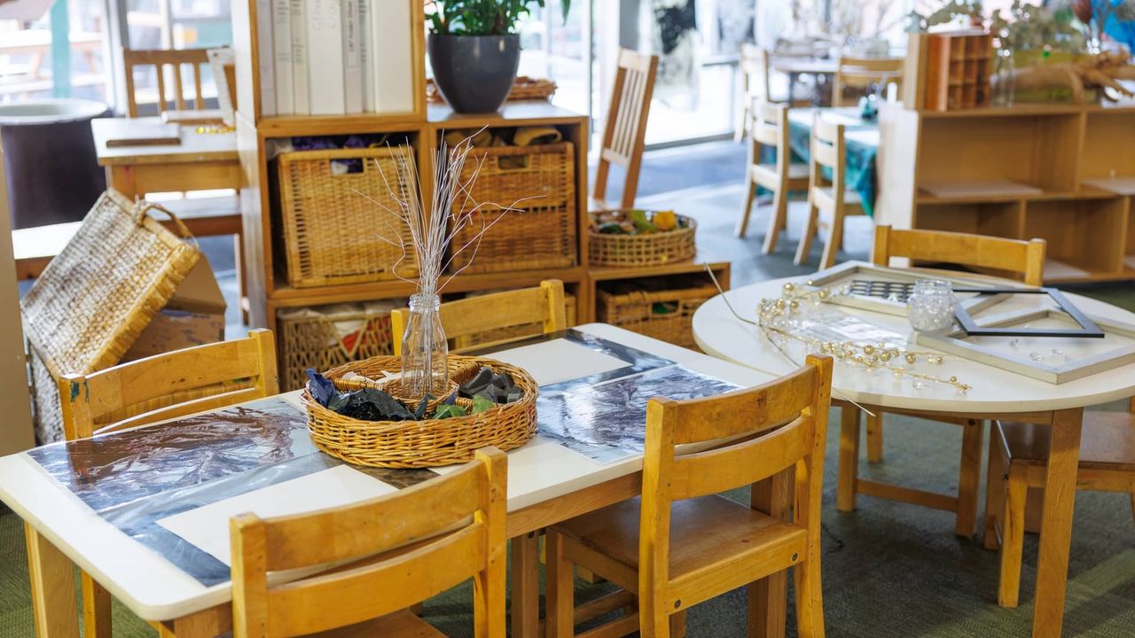 The interior of the St Michael's Grammar School ELC, showing a calm, thoughtfully arranged learning environment with natural materials, wicker baskets and child-sized furniture.