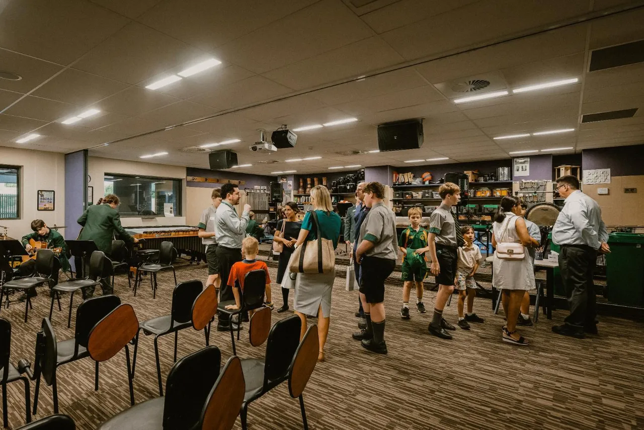 Students and families touring the Music classrooms