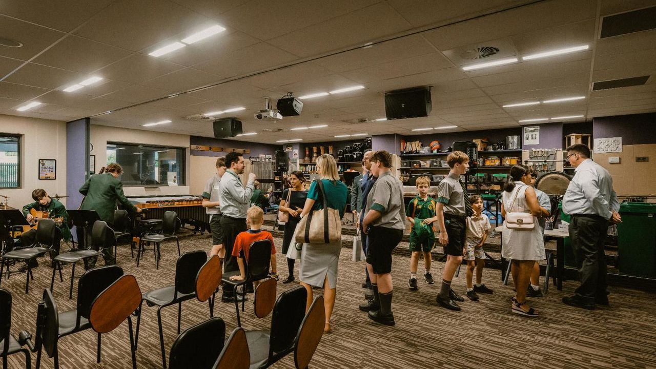 Students and families touring the Music classrooms
